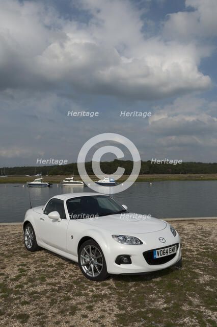 2014 Mazda MX5 Roadster Coupe Artist: Unknown.