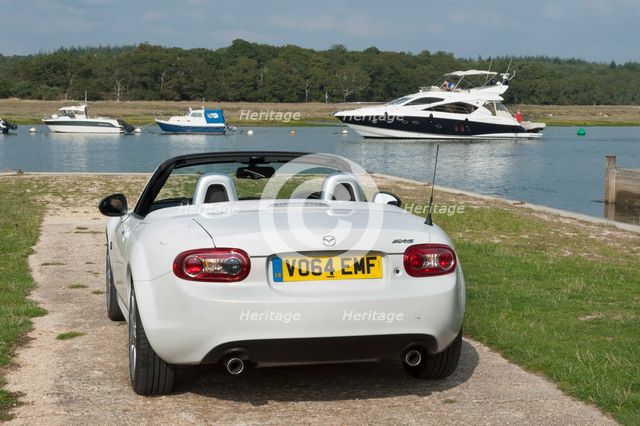 2014 Mazda MX5 Roadster Coupe Artist: Unknown.