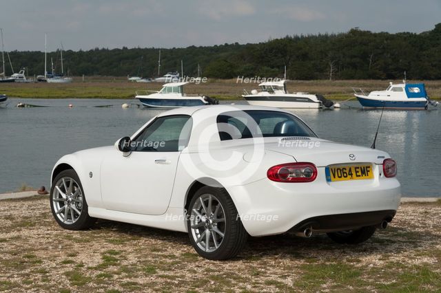 2014 Mazda MX5 Roadster Coupe Artist: Unknown.