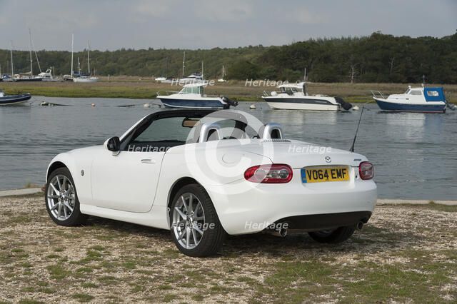 2014 Mazda MX5 Roadster Coupe Artist: Unknown.