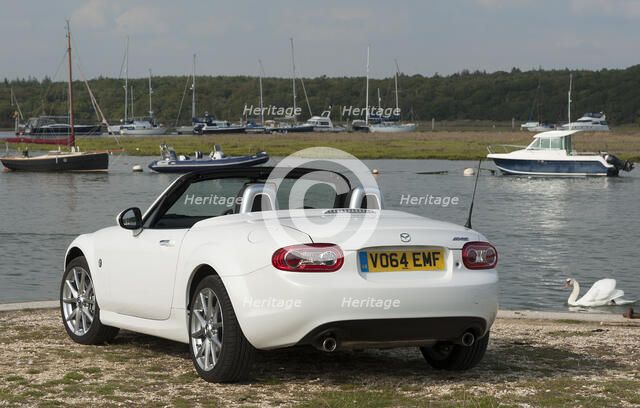 2014 Mazda MX5 Roadster Coupe Artist: Unknown.