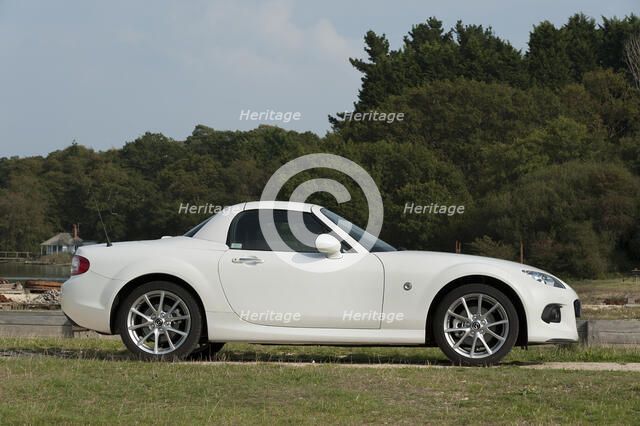 2014 Mazda MX5 Roadster Coupe Artist: Unknown.