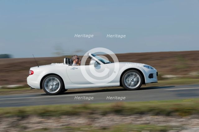 2014 Mazda MX5 Roadster Coupe Artist: Unknown.