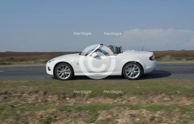 2014 Mazda MX5 Roadster Coupe Artist: Unknown.