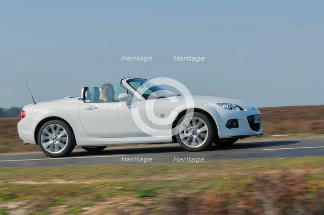 2014 Mazda MX5 Roadster Coupe Artist: Unknown.