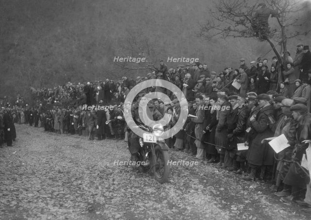 250 cc Triumph of J Stagg competing in the MCC Lands End Trial, Beggars Roost, Devon, 1936. Artist: Bill Brunell.