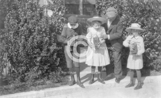 3 children sighting box cameras, c1905. Creator: Frances Benjamin Johnston.