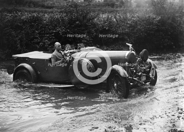 3-litre Lagonda of RD Tong fording the River Exe at Yealscombe, Devon, JCC Lynton Trial, 1932. Artist: Bill Brunell.