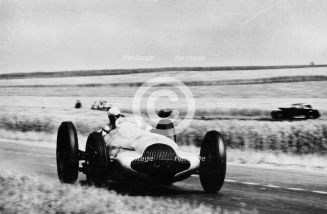 3 litre Mercedes in action, French Grand Prix, Rheims, 1938. Artist: Unknown