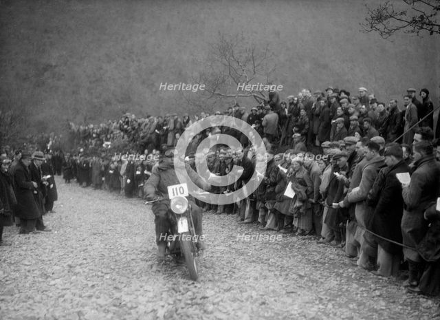 347 cc AJS of J Hey competing in the MCC Lands End Trial, Beggars Roost, Devon, 1936. Artist: Bill Brunell.