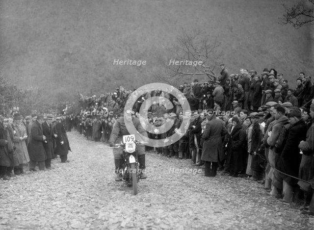347 cc AJS of RW Cassam competing in the MCC Lands End Trial, Beggars Roost, Devon, 1936. Artist: Bill Brunell.