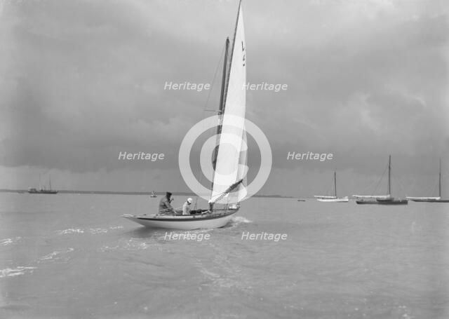 6 Metre Class 'Jonquil' (L5) with Captain R J Dixon at the helm. Creator: Kirk & Sons of Cowes.