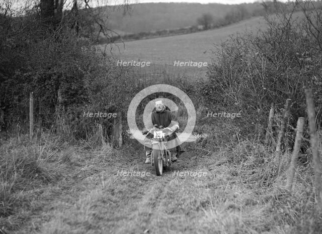 600 cc Ariel Square Four of HLS Sikes competing in the Inter-Varsity Trial, November 1931. Artist: Bill Brunell.