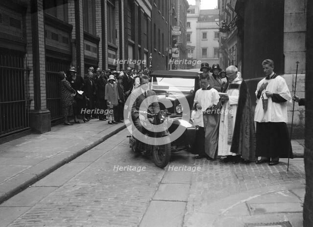 600 cc Douglas motorcycle combination and a Morris Minor at a motor vehicle blessing ceremony. Artist: Bill Brunell.