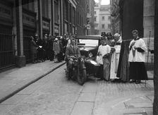 600 cc Douglas motorcycle combination and a Morris Minor at a motor vehicle blessing ceremony. Artist: Bill Brunell