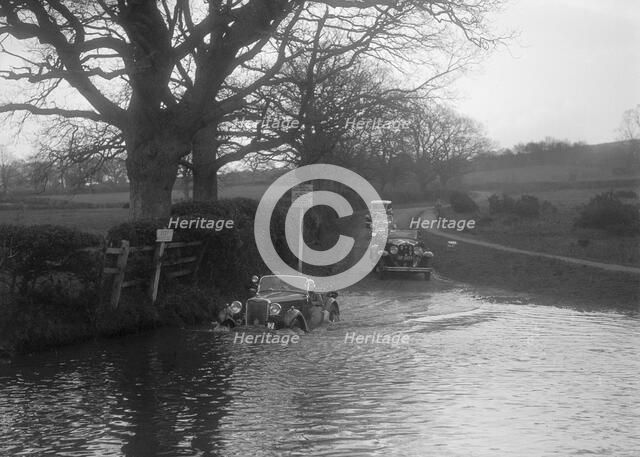 972 cc Singer Le Mans driving through water during a motoring trial, 1936. Artist: Bill Brunell.