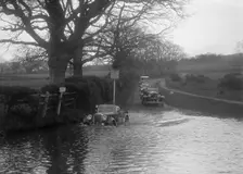 972 cc Singer Le Mans driving through water during a motoring trial, 1936. Artist: Bill Brunell