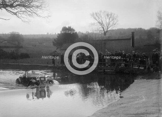 972 cc Singer Le Mans driving through a ford during a motoring trial, 1936. Artist: Bill Brunell.