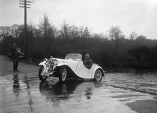 972 cc Singer Le Mans driving through a ford during a motoring trial, 1936. Artist: Bill Brunell