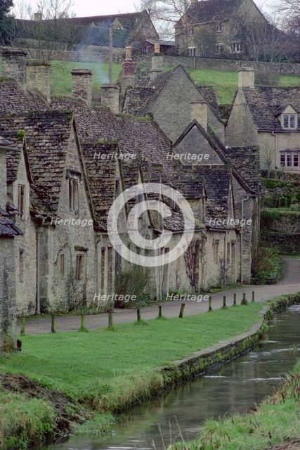 Cotswold stone cottages, Bibury, Gloucestershire. Creator: Tony Evans.