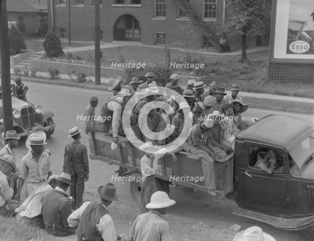 Cotton hoers are transported to the fields daily during the season, Memphis, Tennessee, 1937. Creator: Dorothea Lange.