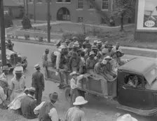 Cotton hoers are transported to the fields daily during the season, Memphis, Tennessee, 1937. Creator: Dorothea Lange