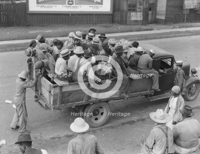 Cotton hoers are transported to the fields daily during the season, Memphis, Tennessee, 1937. Creator: Dorothea Lange.
