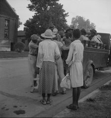 Cotton hoers leaving Greenville at 5 am for a day's work on the plantations, Mississippi, 1937. Creator: Dorothea Lange