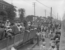 Cotton hoers loading at Memphis, Tennessee for the day's work in Arkansas, 1937. Creator: Dorothea Lange
