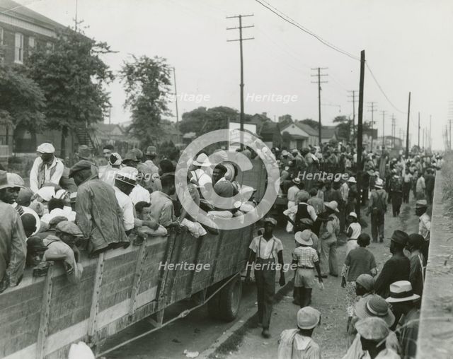 Cotton hoers loading at Memphis for the day's work in Arkansas; June, 1937. Creators: Farm Security Administration, Dorothea Lange.