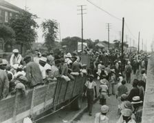 Cotton hoers loading at Memphis for the day's work in Arkansas; June, 1937. Creators: Farm Security Administration, Dorothea Lange