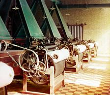 Cotton textile mill interior with machines producing cotton thread, probably..., between 1905-1915. Creator: Sergey Mikhaylovich Prokudin-Gorsky