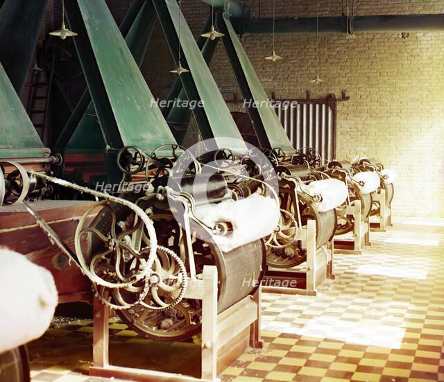 Cotton textile mill interior with machines producing cotton thread, probably..., between 1905-1915. Creator: Sergey Mikhaylovich Prokudin-Gorsky.