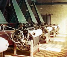Cotton textile mill interior with machines producing cotton thread, probably..., between 1905-1915. Creator: Sergey Mikhaylovich Prokudin-Gorsky