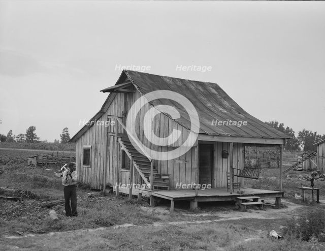 Cottonworker's cabin with outside stairway and loft, near Blytheville, Arkansas, 1937. Creator: Dorothea Lange.