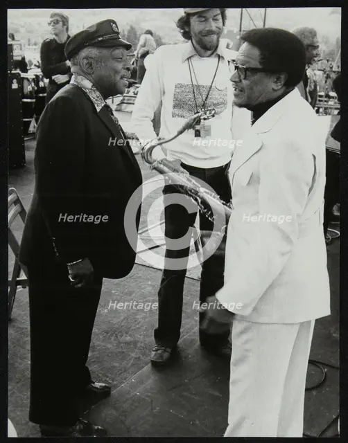 Count Basie chatting with Illinois Jacquet at the Capital Radio Jazz Festival, London, July 1979. Creator: Denis Williams.