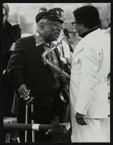 Count Basie chatting with Illinois Jacquet at the Capital Radio Jazz Festival, London, July 1979. Creator: Denis Williams