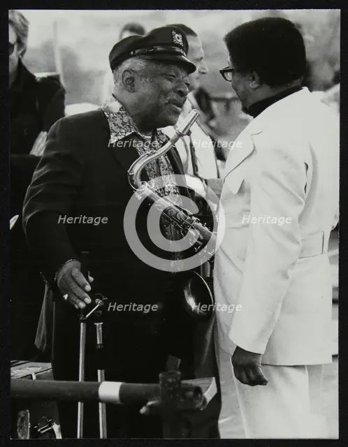 Count Basie chatting with Illinois Jacquet at the Capital Radio Jazz Festival, London, July 1979. Creator: Denis Williams.