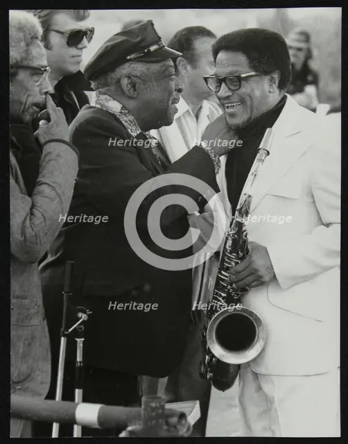 Count Basie chatting with Illinois Jacquet at the Capital Radio Jazz Festival, London, July 1979. Co Creator: Denis Williams.