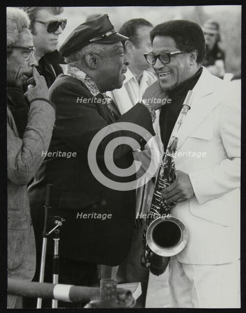 Count Basie chatting with Illinois Jacquet at the Capital Radio Jazz Festival, London, July 1979. Co Artist: Denis Williams