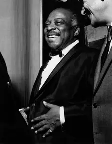 Count Basie backstage, Finsbury Park Astoria, London, 1963. Creator: Brian Foskett