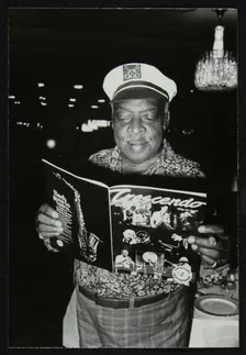 Count Basie reading a copy of Crescendo magazine at the Grosvenor House Hotel, London, 1979. Creator: Denis Williams