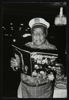 Count Basie reading a copy of Crescendo magazine at the Grosvenor House Hotel, London, 1979. Artist: Denis Williams