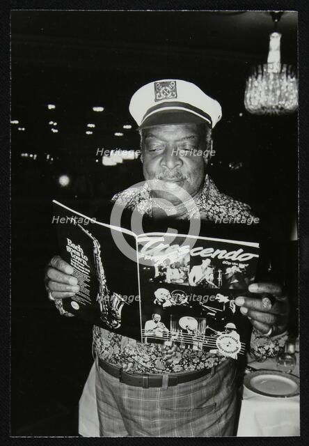 Count Basie reading a copy of Crescendo magazine at the Grosvenor House Hotel, London, 1979. Artist: Denis Williams