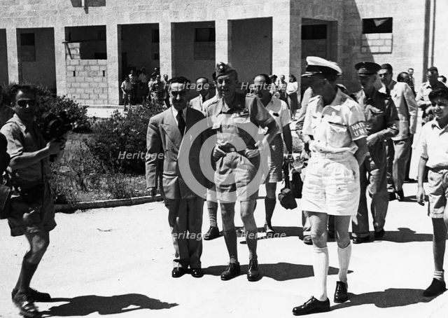 Count Folke Bernadotte (1895-1948) with UN men in the hall of the National Institutions. Artist: Unknown