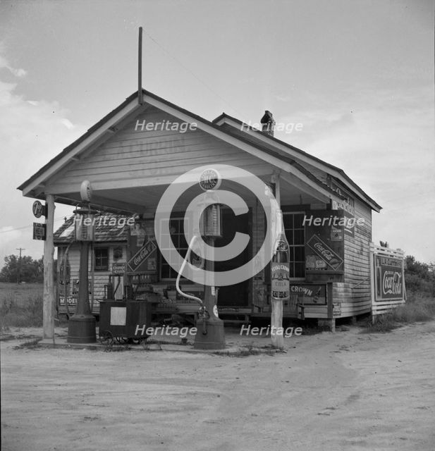 Country filling station owned and operated by tobacco farmer, Granville County, North Carolina, 1939 Creator: Dorothea Lange.