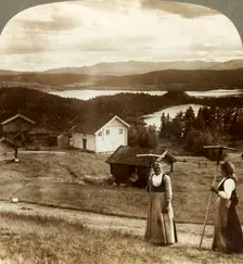 Country girls in haying time - over Bolkesjo and Folsjo (lakes) to Himingen Mts., Norway c1905. Creator: Unknown