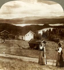 Country girls in haying time - over Bolkesjo and Folsjo (lakes) to Himingen Mts., Norway c1905. Creator: Unknown