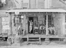 Country store on dirt road, Sunday afternoon, Gordonton, North Carolina, 1939. Creator: Dorothea Lange