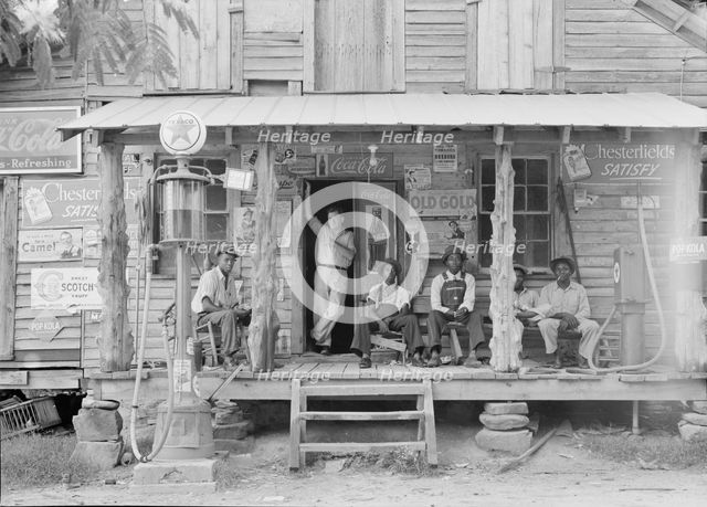Country store on dirt road, Sunday afternoon, Gordonton, North Carolina, 1939. Creator: Dorothea Lange.